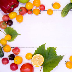 Background with vegetables. Vegetables on a white background wood texture top view. Tomatoes cucumbers peppers apples. Proper nutrition and diet. Concept of vegetarianism and detox.