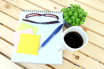 note book on wooden table