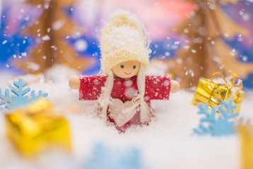 Obraz na płótnie Canvas Snowgirl in a winter background