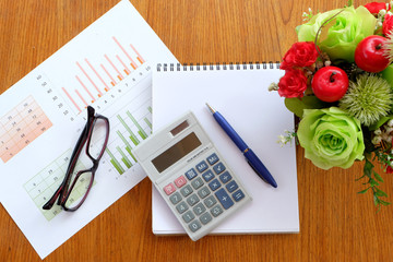 graph paper and note book in business concept