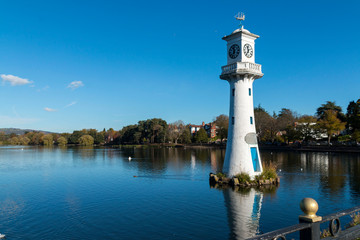 Scott Monument in the autumn sunshine at Roath Park Lake Cardiff South Wales UK