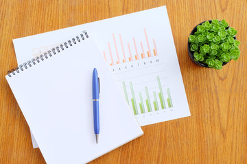 graph paper and note book in business concept
