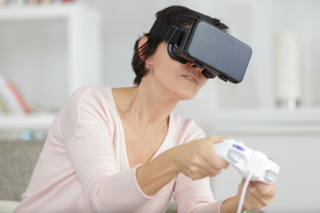 mature female student using virtual reality headset