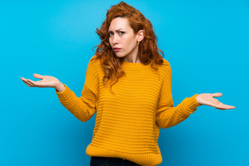 Redhead woman with yellow sweater unhappy for not understand something