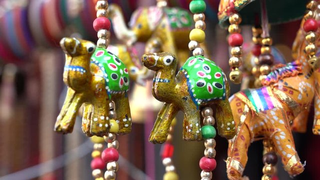 Colorful handmade souvenirs for sale in local street market in Udaipur, Rajasthan, India. Close up