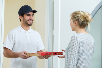 pizza delivery man carrying boxes