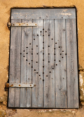 old wooden door with openwork decoration