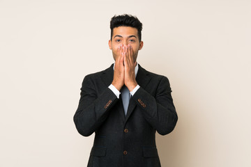 Young handsome businessman man over isolated background with surprise facial expression