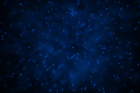 Flowing and glowing particles with dark background, 3d rendering © Vink Fan