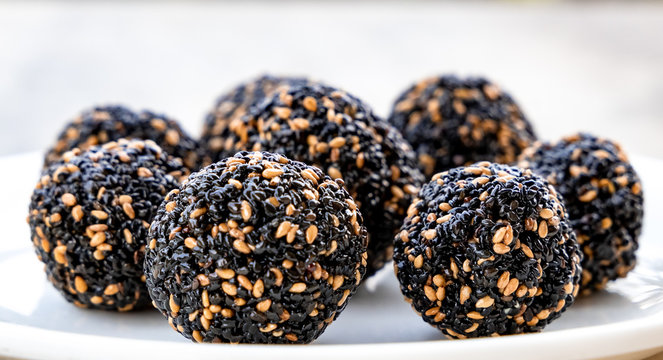 Til ke laddu or Sesame laddu isolated on a white background. Indian sweet