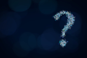 光の集合で描かれたクエスチョンマーク