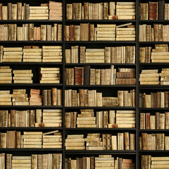 antique books on old wooden shelf.