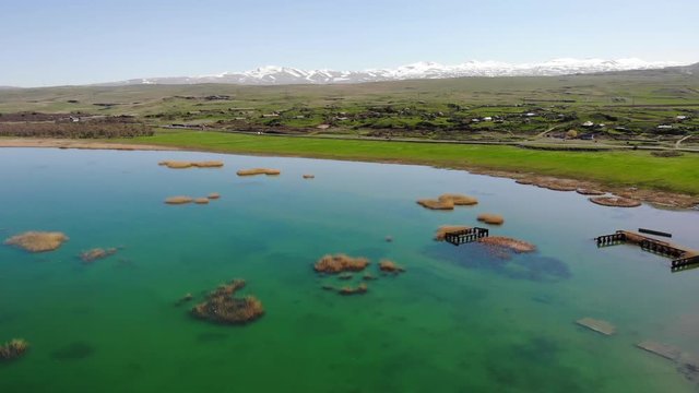 Sevan lake and white clouds on blue sky on a sunny day, Armenia Perfect
