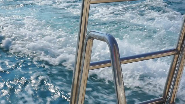 Trace of foamy water on the surface of the ocean due to outboard motor on a boat.1920X1080 Full Hd.