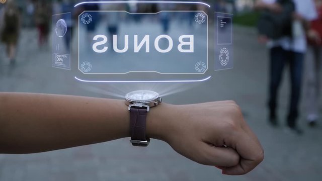 Female hand with futuristic smartwatch shows HUD hologram with text Bonus. Woman uses holographic technology of future on wristwatch against background of evening city with people