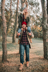 Couple travelers is so fun in the forest. Concept of trekking, adventure and seasonal vacation.