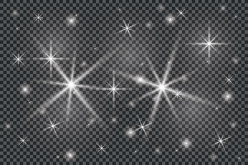 A set of bright beautiful stars. Light effect. Bright Star. Beautiful light for illustration. Christmas star.White sparkles shine special light effect. Vector sparkles on a transparent background