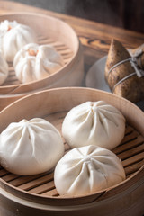 chinese steamed bun in traditional bamboo steamer