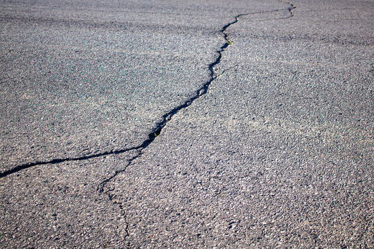 Cracked Asphalt on a Paved Road