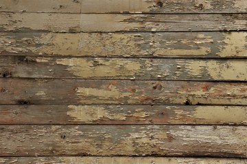 old boards with traces of light beige paint