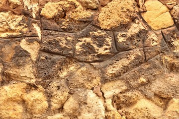 stony rough yellow and brown rough surface
