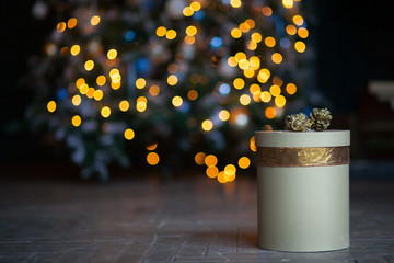 New year festive golden present on christmas lights background