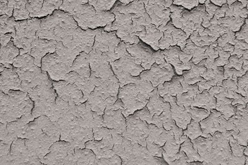 gray-brown putty cracking and moving away from the surface
