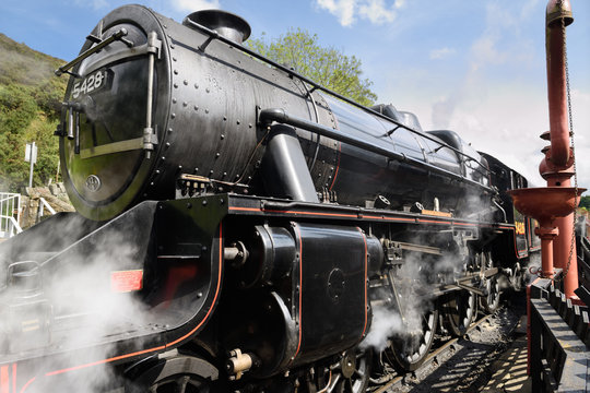 Stanier Black Five LMS 5428 Steam Engine built in 1937 arriving at Goathland railway station North Yorkshire Moors Railway line England