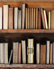 old books on wooden shelf.