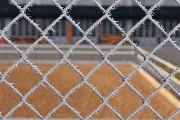 Fototapeta premium chain link fence with hoar frost 