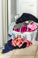 Close-up of dirty laundry piled high in a basket