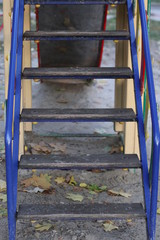 Fototapeta na wymiar blue stairs in the playground in autumn
