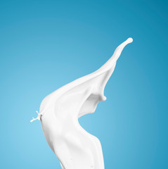 milk or white liquid splash on blue background.