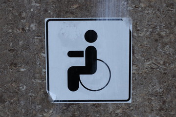 disabled parking sign on wall