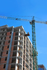Crane and highrise construction site