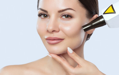 Carbon face peeling procedure in a beauty salon. Hardware cosmetology treatment.