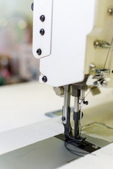 professional production sewing machine close-up, leather production, seamstress, tailor