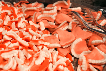 View of a bowl full of candy looking alike false teeth