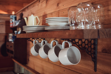 Mugs and dishes on a shelf