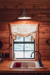 Obraz premium Kitchen sink in a cabin in the woods