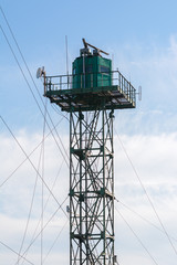 working weather station tower against blue the sky
