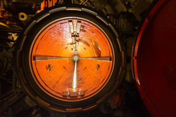 Obraz na płótnie Canvas the torpedo room on a combat submarine torpedo launching tube, military