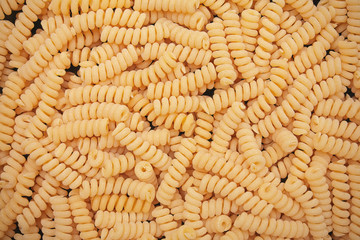 pasta from durum wheat curls fusilli, cavatappi, unprepared, raw pasta cellentani handmade on background
