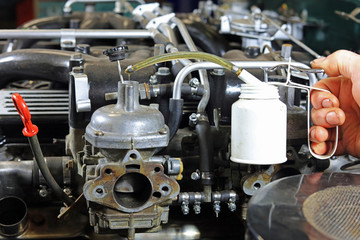 Drop Of Oil Being Added To A Engine Carburettor On A Classic Car