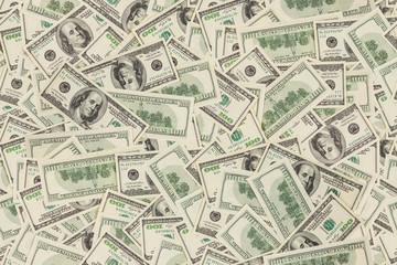 flat seamless texture and background of real one hundred us dollar banknotes