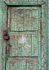 old wooden door with rusty lock on white background