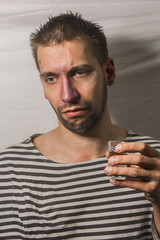 male alcoholism. drinking father, a man drinks vodka. feeling unwell. assault, booze at home. stop alcohol