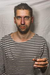 male alcoholism. drinking father, a man drinks vodka. feeling unwell. assault, booze at home. stop alcohol