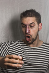 male alcoholism. drinking father, a man drinks vodka. feeling unwell. assault, booze at home. stop alcohol