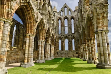 Poster Chancel and wall of the Sanctuary of Gothic ruins of Whitby Abbey church in sunshine North York Moors National Park England © Reimar